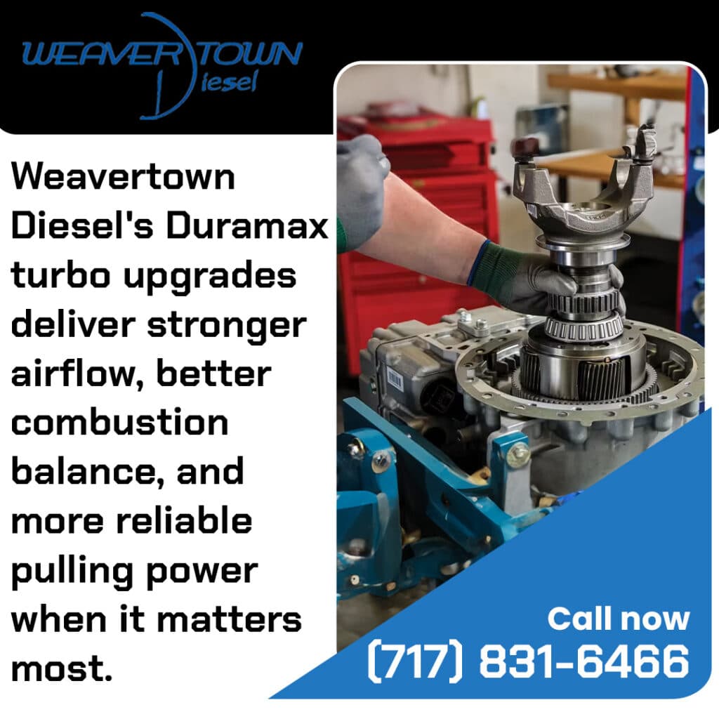 Technician installing Duramax turbo upgrade on diesel engine to improve airflow and performance