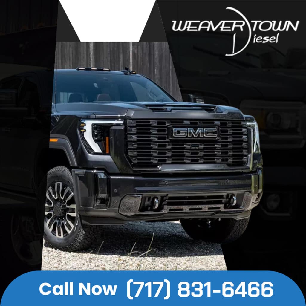 Front view of a black GMC Sierra Denali HD pickup truck with Weavertown Diesel branding and phone number.